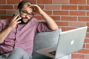 person looking confused using a computer